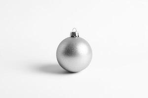 A Single Silver Christmas Ornament on a White Background photo