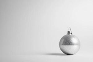 A Single Silver Christmas Ornament on a White Background photo