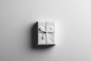 A White Gift Box with a White Ribbon Bow on a White Background photo
