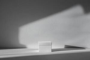 White Box on White Surface with Light and Shadow photo