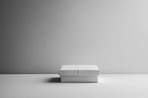 White Gift Box on a White Surface with a Grey Background photo
