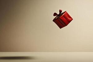 Red Gift Box Floating Against a Cream Wall photo