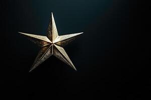 A Glittering Gold Star on a Dark Background photo