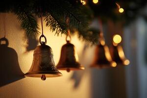 Gold Bells Hanging From a Christmas Tree Branch photo