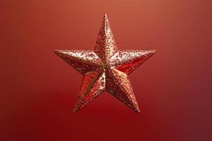 A Glittering Red Star Ornament Against a Red Background photo