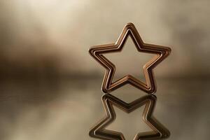 A Gold Star Reflecting on a Smooth Surface photo