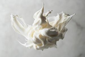 A Whirl of Whipped Cream Against a Light Background photo