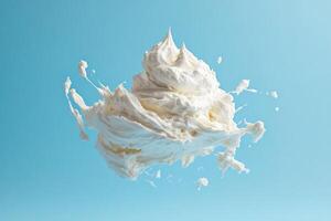 White Whipped Cream Splashing Against a Blue Background photo