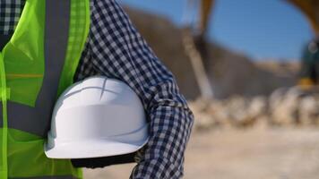 Builder with helmet in hand video