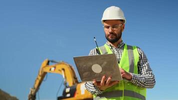 Engineer geologist using laptop in quarry video