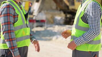 Two men workers shaking hands at quarry video