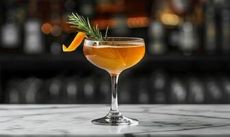 Crystal Glass Filled With Icy Orange Cocktail on Bar Counter photo