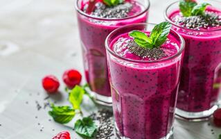 Two Glasses of Raspberry Chia Seed Smoothie With Fresh Mint photo