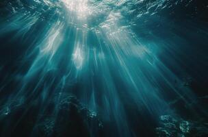 Underwater Sunlight Beams Through Ocean Cave photo