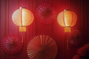 Colorful lanterns and decorative fans displayed at a festive event celebrating traditional culture photo