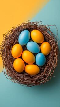 Brightly colored eggs in a natural nest on a vibrant yellow background during springtime photo