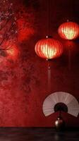 Elegant red lanterns and a decorative fan in a cozy Asian inspired room photo