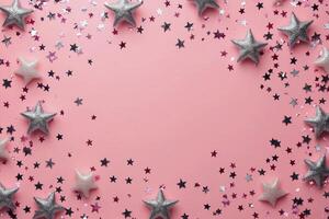 Decorative silver stars arranged in a circular pattern on a pink background for festive celebrations photo