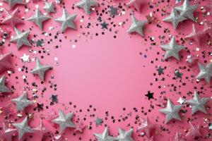 Decorative silver stars arranged in a circular pattern on a pink background for festive celebrations photo