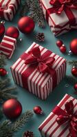 Red and white striped gift boxes and ornaments on a festive holiday background photo
