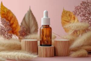Serum bottle placed on wooden stump surrounded by dried flowers and leaves in soft light photo