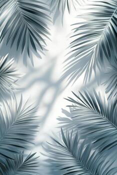 Lush green palm leaves create a serene atmosphere against a light background photo