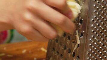 Close-up of Grating an Apple with a Metal Grater video