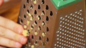 Grating Cheese on a Metal Grater video