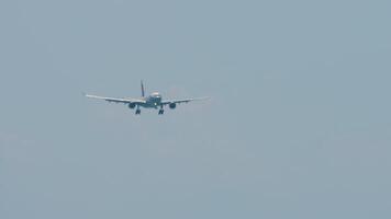 Airplane descending preparing for landing. Airliner with unrecognizable livery in the sky video