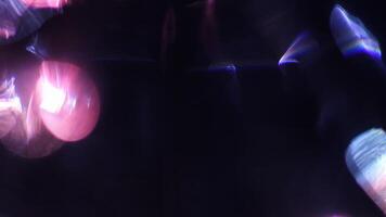 Glistening ruby shards scatter light in arcs. video