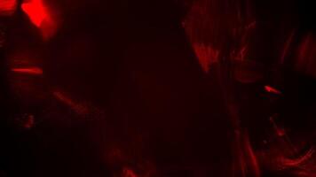 An abstract red light is shining on a black background video