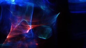 A blue and red light flare is shown in the dark forms abstract background video