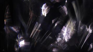 Pearlescent glows ripple across uneven surfaces. video