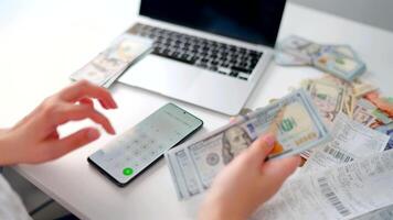 Woman calculating monthly home expenses, taxes and bank account balance. video