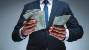 Formally dressed man is counting US Dollar bills, close-up. video