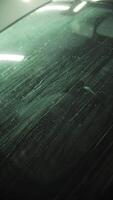 Rinsing the automobile with water at a car wash video