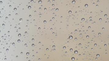Raindrops in the glass of a window while raining outside video