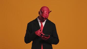 Red devil manager browsing on smartphone video