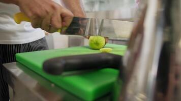 Chef Cuts Lemon On A Chopping Board At A Restaurant video