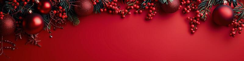 Red Christmas Ornaments and Holly Sprigs on a Red Background photo