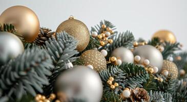 Close Up of Gold and Silver Ornaments Hanging on a Christmas Tree photo