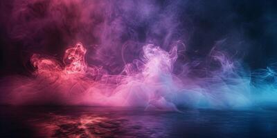 Pink And Blue Smoke Swirling Above A Reflective Surface photo