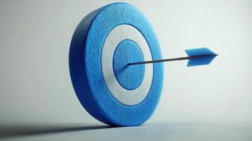 Arrow hitting blue bullseye target on a white background photo