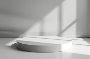 White Cylindrical Platform in a Modern Room With Sunlight photo