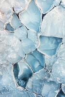 Ice formations creating patterns on a frozen lake during winter photo