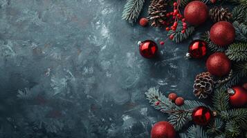 Red Christmas Ornaments and Pine Branches on a Dark Blue Background photo