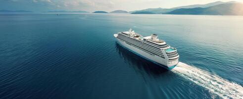 Luxury Cruise Ship Sailing Through Calm Ocean at Dusk photo