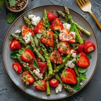 Fresh Strawberry and Asparagus Salad With Goat Cheese and Sesame Seeds photo