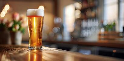A Glass of Beer on a Bar Counter in a Pub at Night photo