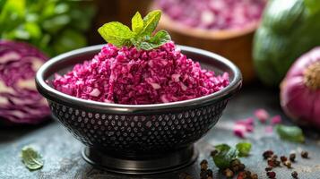Freshly cut red cabbage with greens in a bowl on a stone countertop photo